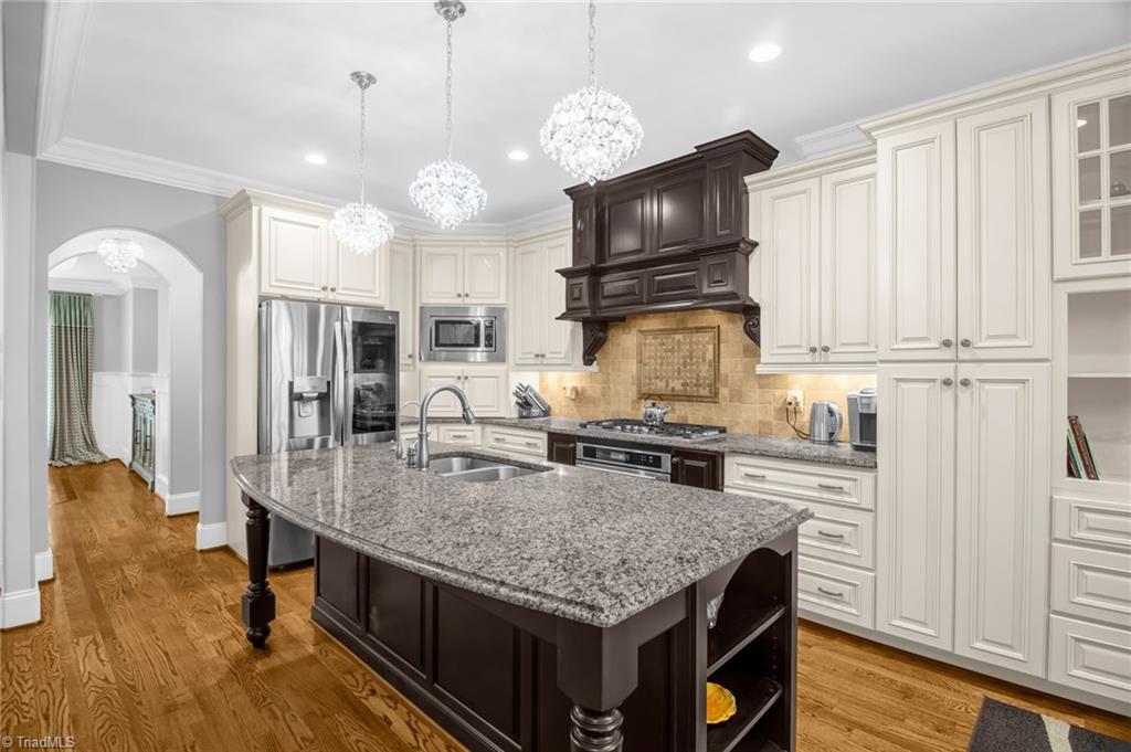 8174 Rob Roy Drive Summerfield, NC 27358 - Photo 9 of 47 Kitchen with granite center island