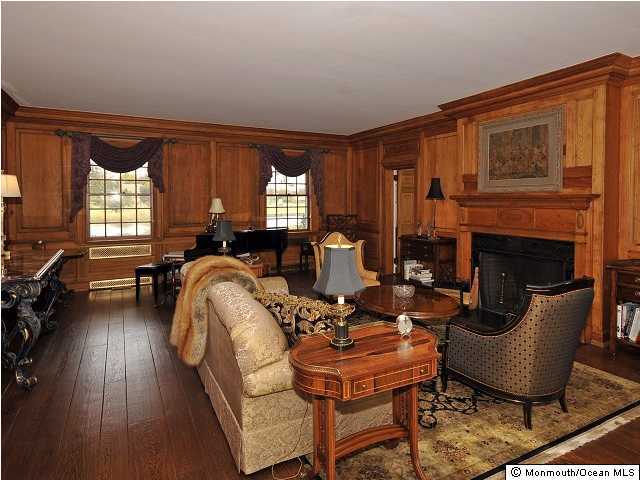 216 Seven Bridges Road Little Silver, NJ 07739 - Photo 12 of 21 a living room with furniture fireplace and a large window
