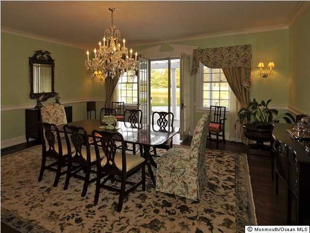 216 Seven Bridges Road Little Silver, NJ 07739 - Photo 14 of 21 a view of a dining room with furniture and chandelier