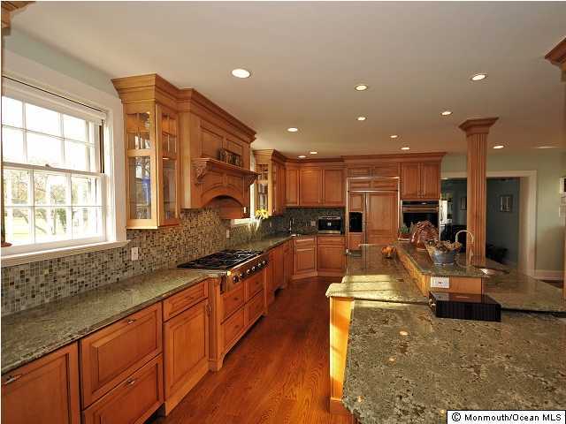 216 Seven Bridges Road Little Silver, NJ 07739 - Photo 17 of 21 a large kitchen with stainless steel appliances granite countertop a large counter top a stove and a sink