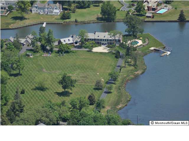216 Seven Bridges Road Little Silver, NJ 07739 - Photo 3 of 21 a view of a lake with a houses