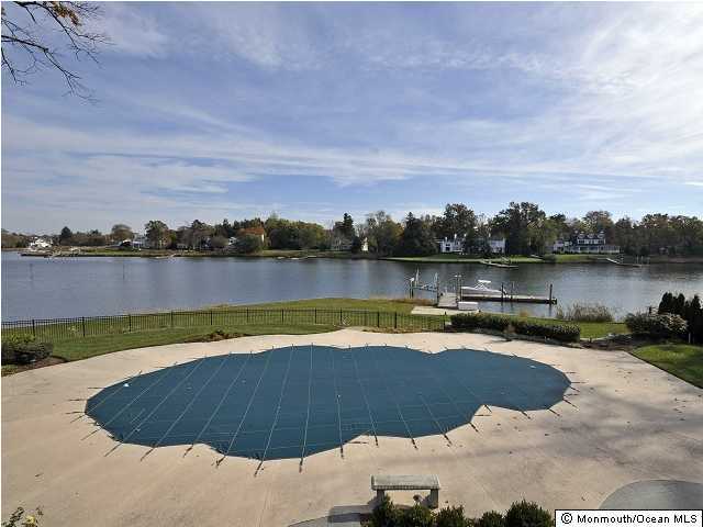 216 Seven Bridges Road Little Silver, NJ 07739 - Photo 21 of 21 a view of a lake with houses in the back