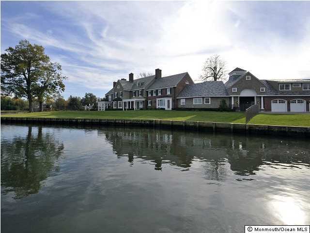 216 Seven Bridges Road Little Silver, NJ 07739 - Photo 8 of 21 a view of a lake with a building in front of it