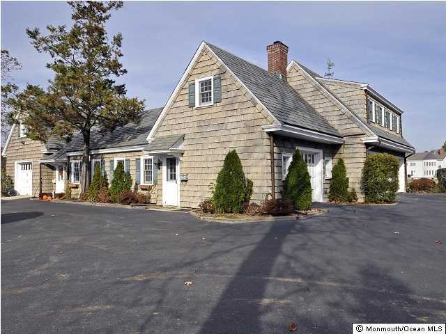 216 Seven Bridges Road Little Silver, NJ 07739 - Photo 9 of 21 a front view of a house with garden