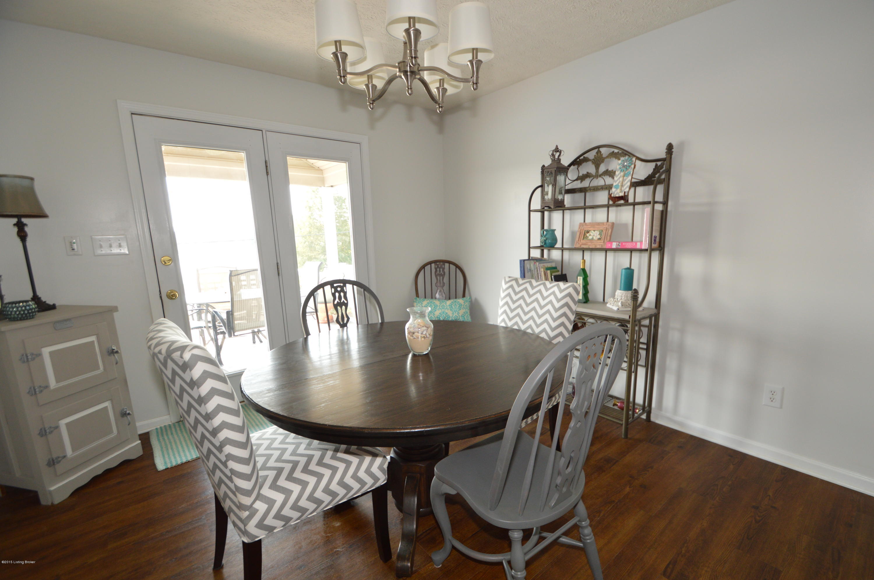 The dining area has French Doors that lead to the large deck which is partially covered.