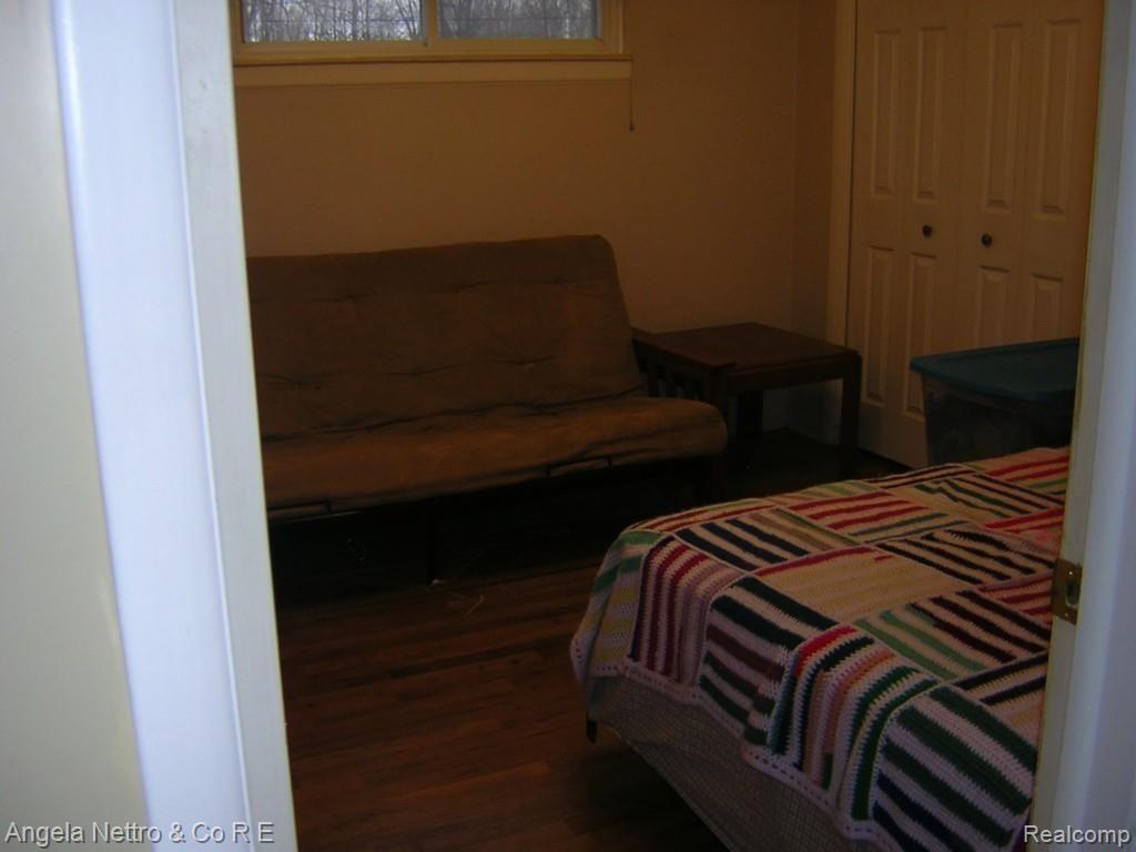 19700 Karr Road Belleville, MI 48111 - Photo 11 of 23 BEDROOM WITH HARDWOOD FLOOR