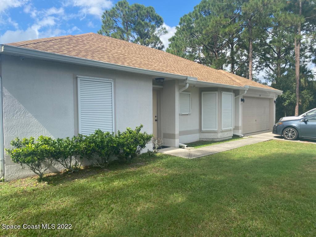 280 Wendover Road Southwest Palm Bay, FL 32908 - Photo 1 of 15 a backyard of a house