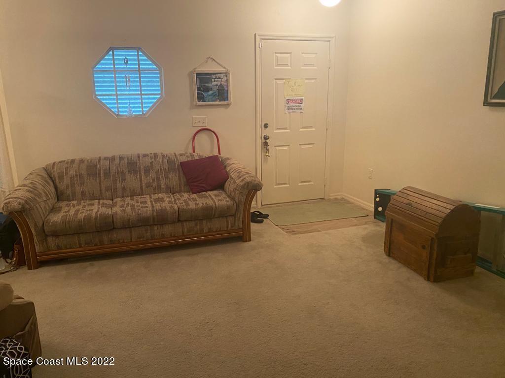 280 Wendover Road Southwest Palm Bay, FL 32908 - Photo 3 of 15 a living room with furniture and a window