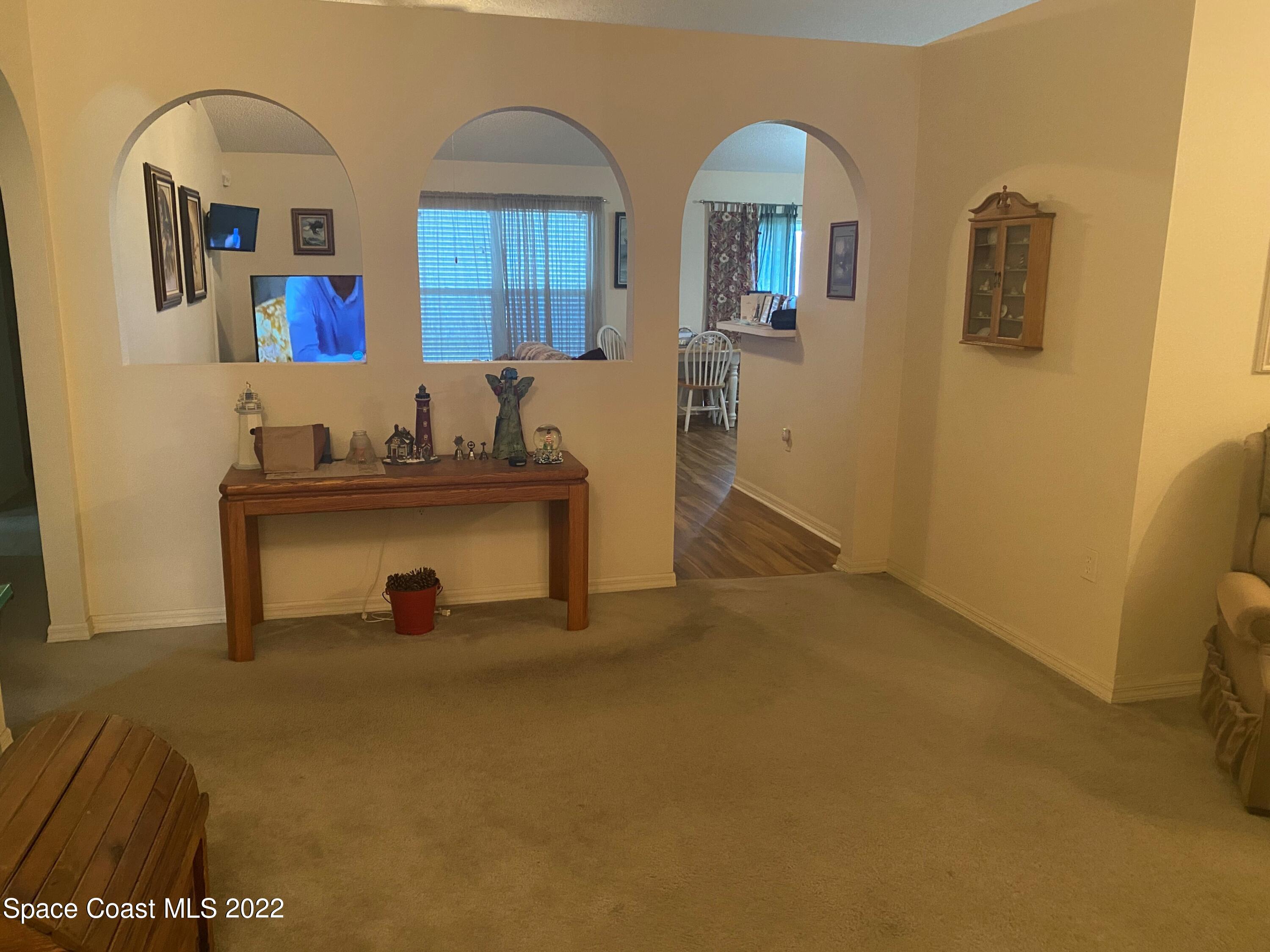 280 Wendover Road Southwest Palm Bay, FL 32908 - Photo 4 of 15 a view of hall way with furniture