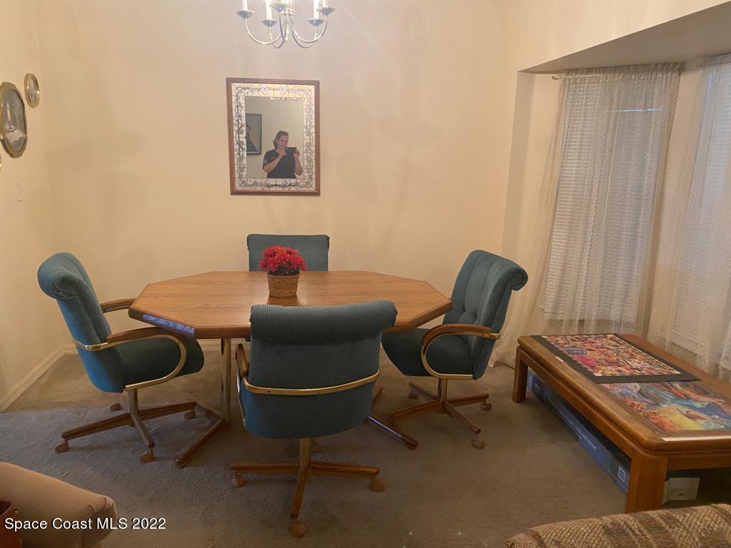 280 Wendover Road Southwest Palm Bay, FL 32908 - Photo 9 of 15 a dining room with furniture and a window