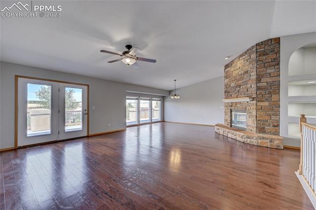 9932 Rockingham Drive Peyton, CO 80831 - Photo 5 of 7 Great room with huge fireplace and tons of natural light