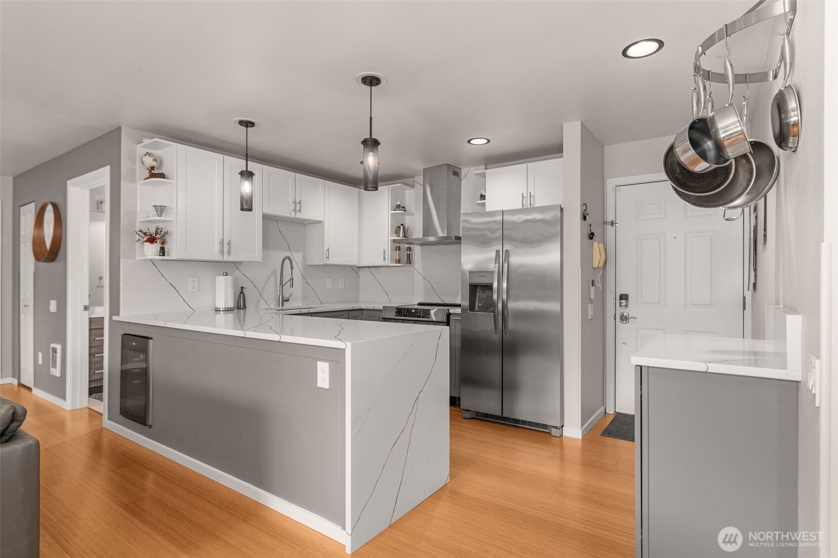 115 West Galer Street, Unit 101 Seattle, WA 98119 - Photo 11 of 19 a kitchen with stainless steel appliances granite countertop a refrigerator a stove and a sink