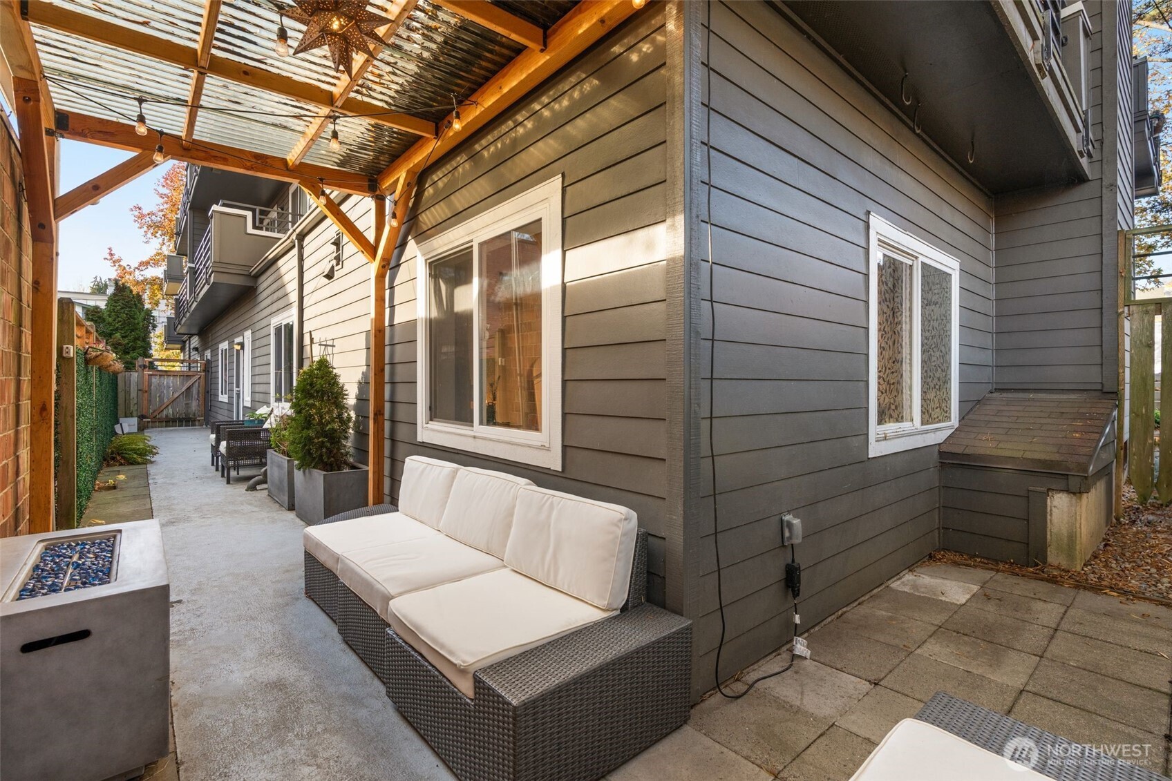 115 West Galer Street, Unit 101 Seattle, WA 98119 - Photo 18 of 19 a backyard of a house with outdoor seating