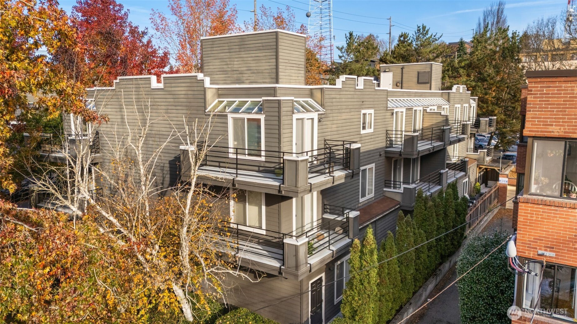 115 West Galer Street, Unit 101 Seattle, WA 98119 - Photo 19 of 19 an aerial view of a residential apartment building with a yard