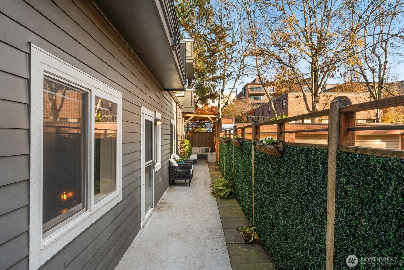 115 West Galer Street, Unit 101 Seattle, WA 98119 - Photo 2 of 19 a backyard of a house with lots of green space