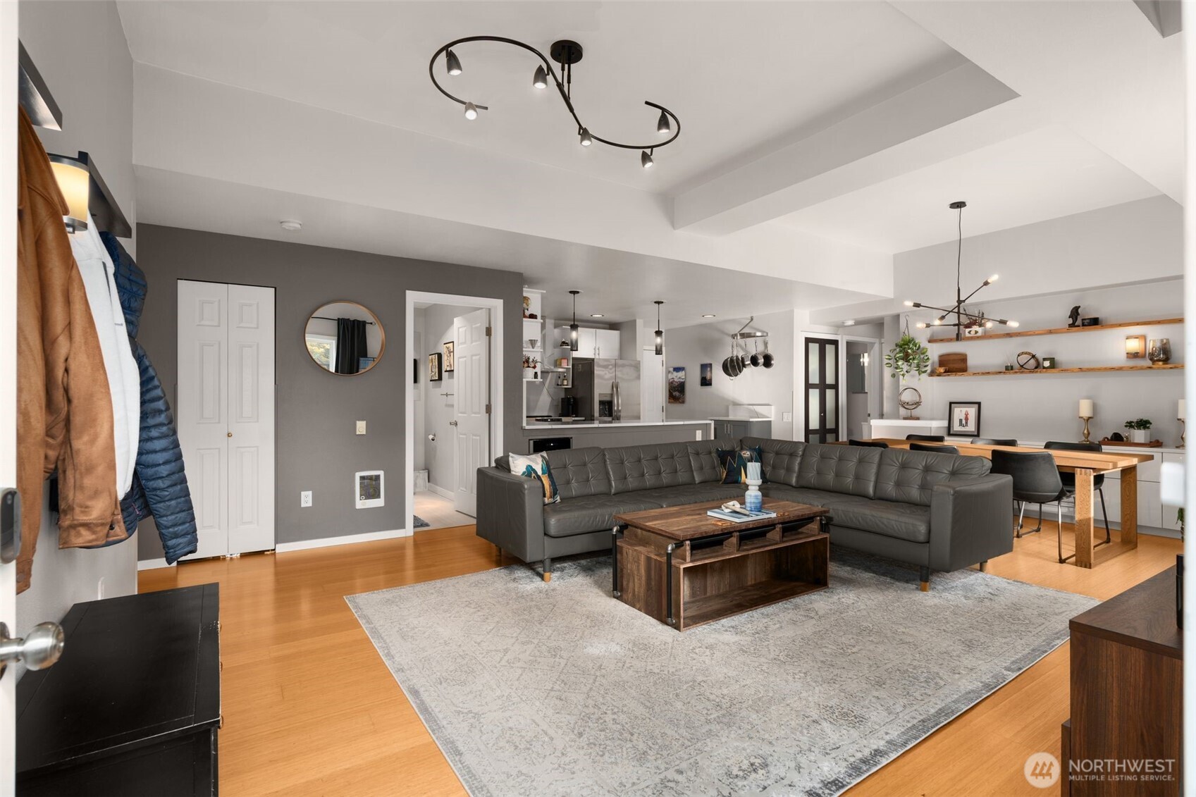 115 West Galer Street, Unit 101 Seattle, WA 98119 - Photo 3 of 19 a living room with furniture and a flat screen tv