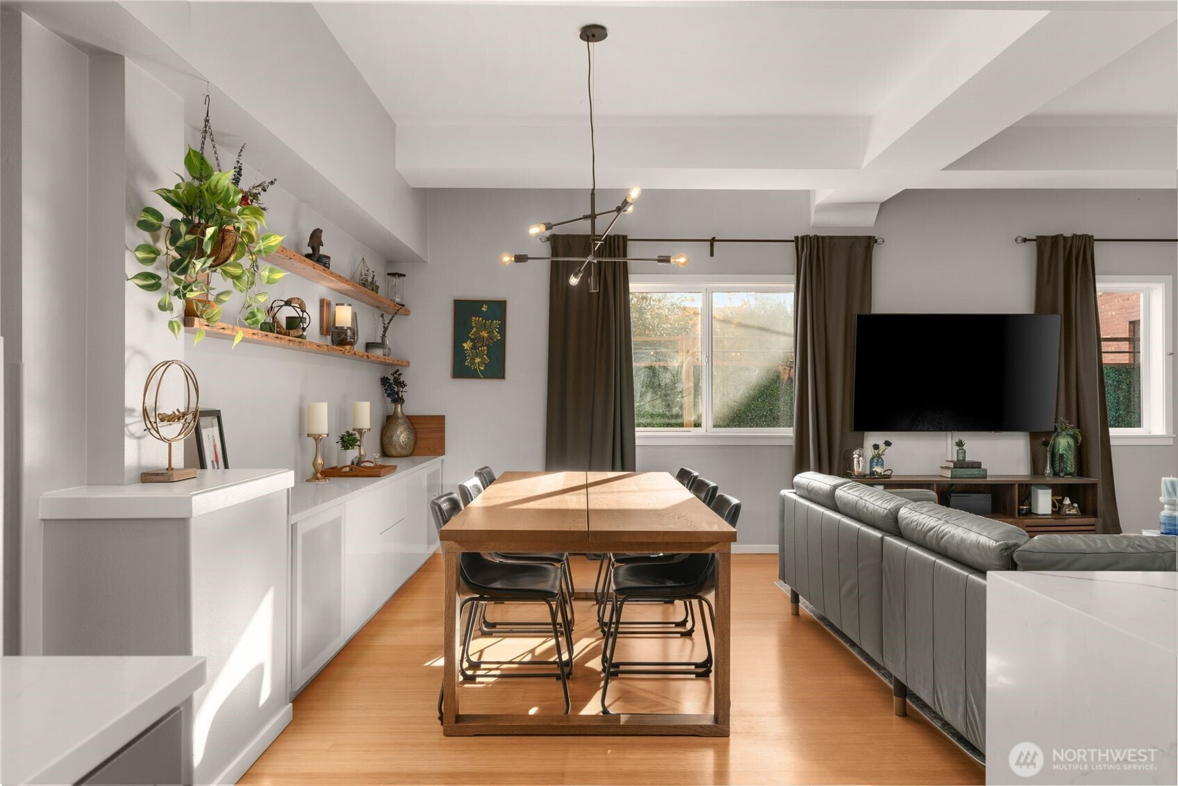 115 West Galer Street, Unit 101 Seattle, WA 98119 - Photo 7 of 19 a living room with furniture and a flat screen tv