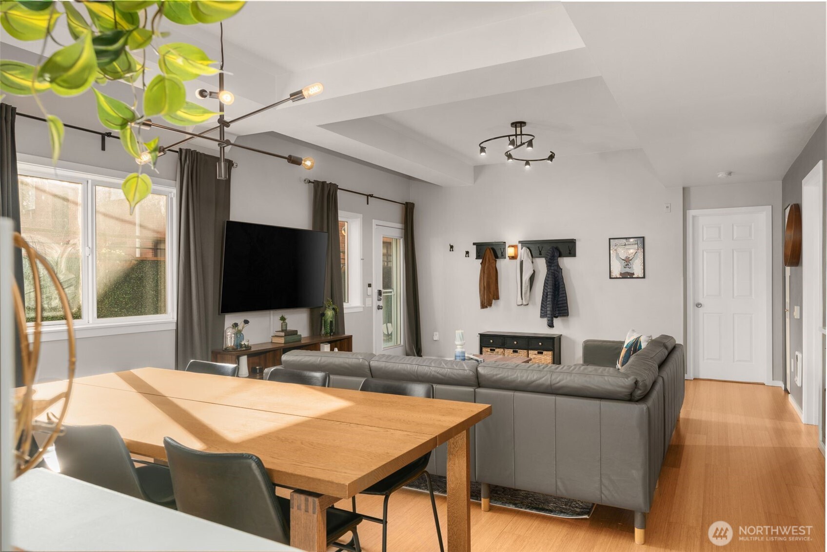 115 West Galer Street, Unit 101 Seattle, WA 98119 - Photo 8 of 19 a living room with furniture and a flat screen tv