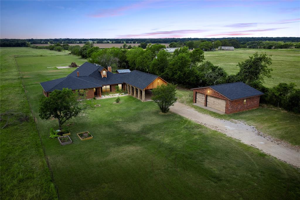 3433 West Tours Road West, TX 76691 - Photo 2 of 40 a view of a big house with a big yard