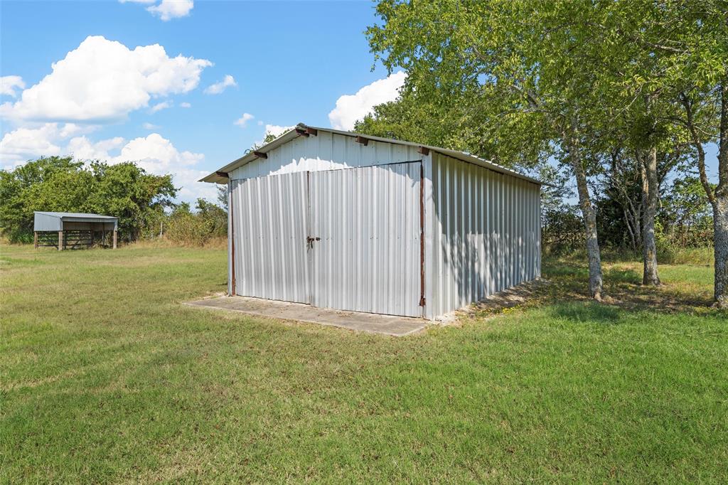 3433 West Tours Road West, TX 76691 - Photo 35 of 40 a front view of a house having yard