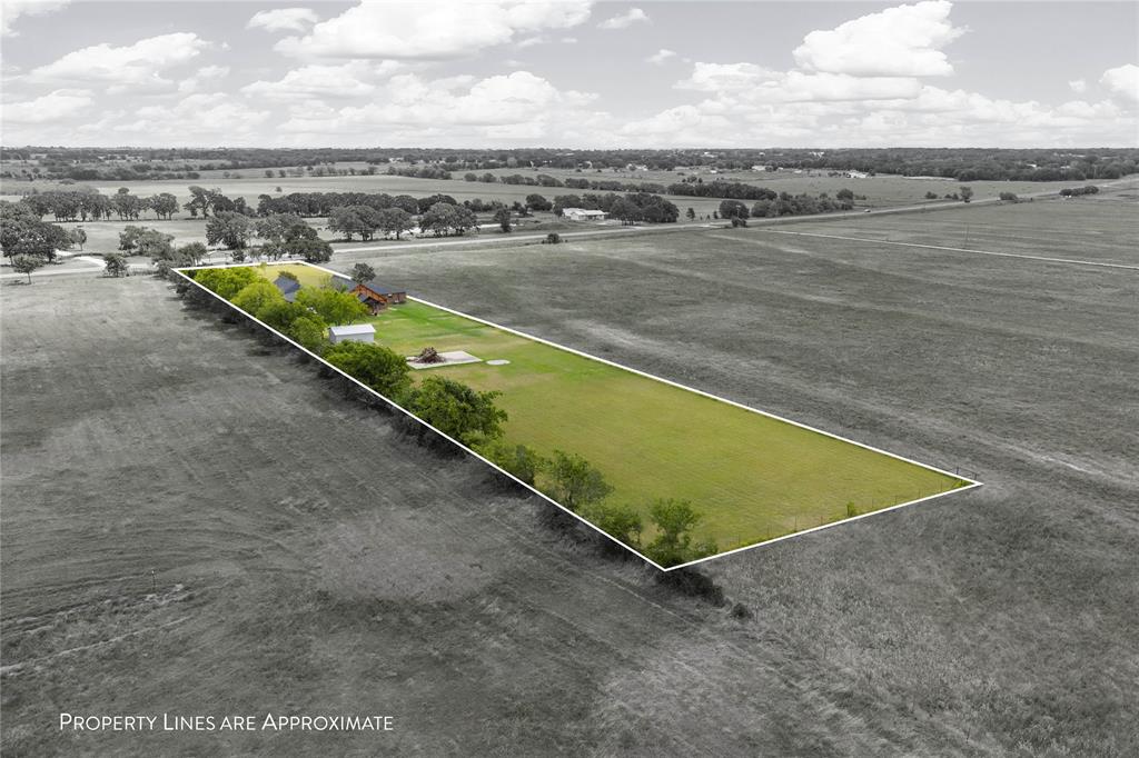 3433 West Tours Road West, TX 76691 - Photo 38 of 40 an aerial view of a swimming pool and lake