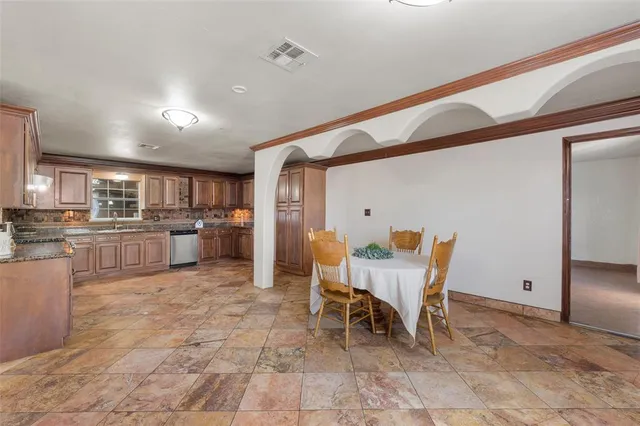 a view of a kitchen and dining room