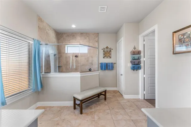 a view of kitchen with refrigerator and window