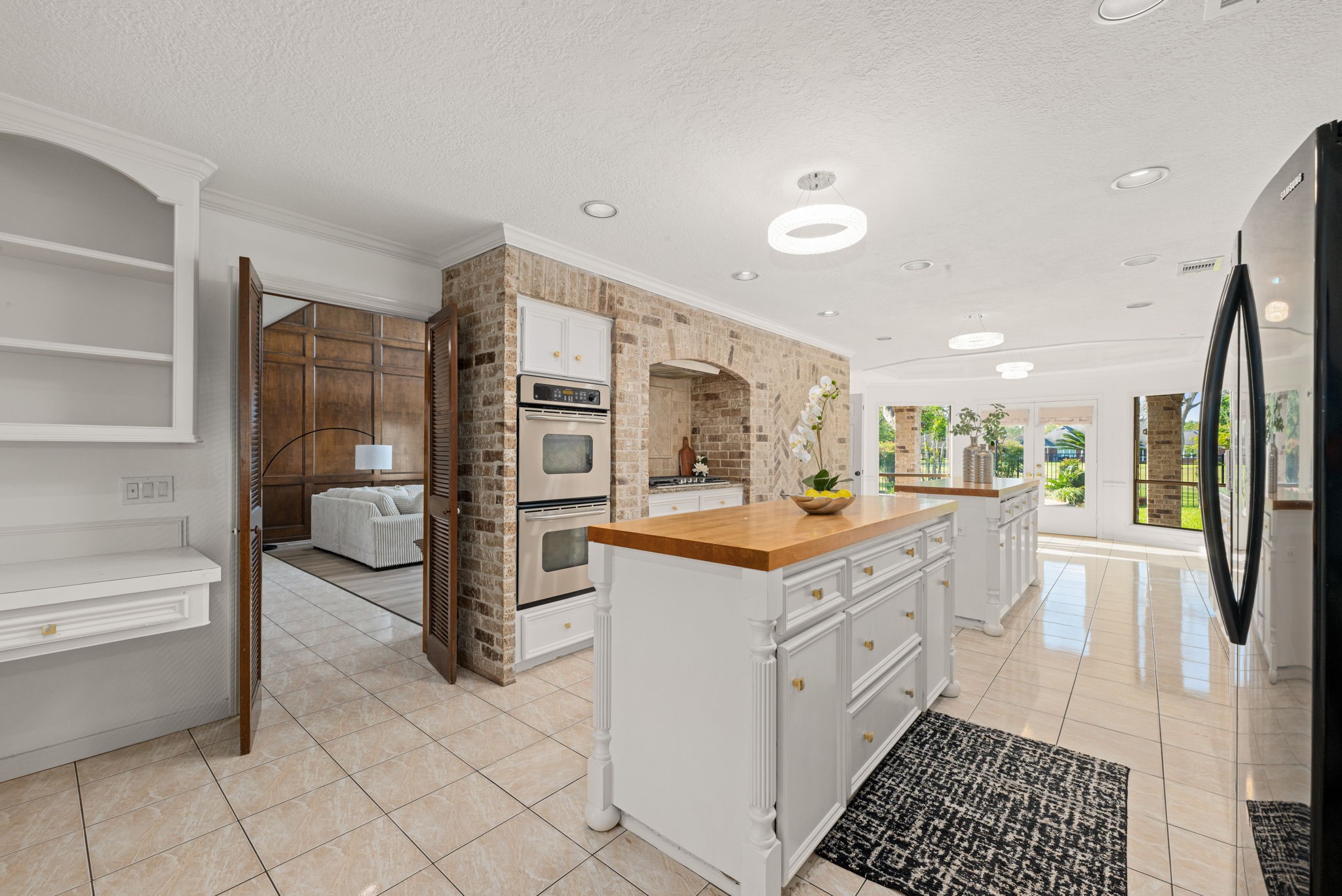3122 Robinson Road Missouri City, TX 77459 - Photo 9 of 45 Gourmet chef’s kitchen featuring dual islands, granite counters, and premium stainless appliances.