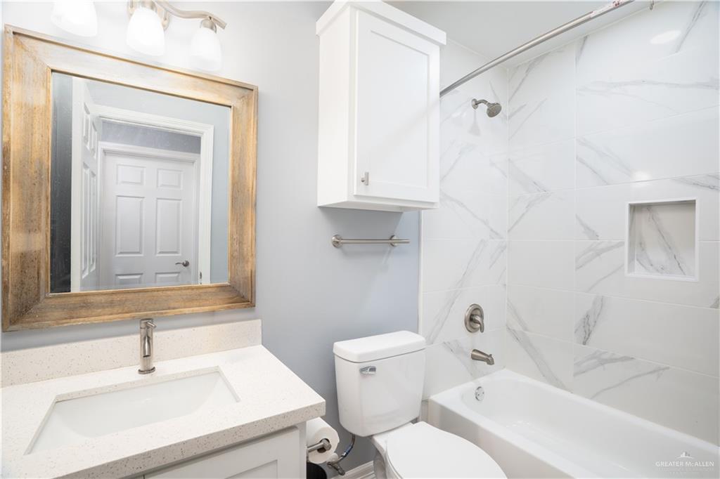 212 North Street Mission, TX 78572 - Photo 12 of 26 a bathroom with a sink toilet and shower