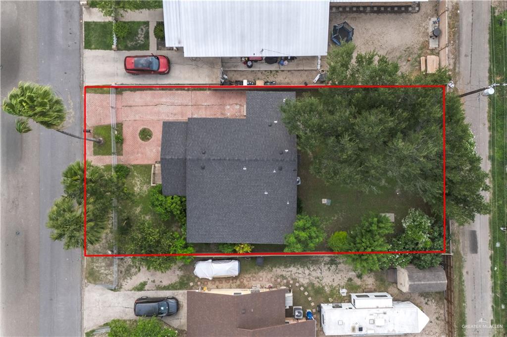212 North Street Mission, TX 78572 - Photo 20 of 26 an aerial view of a house with a yard and a wooden bench