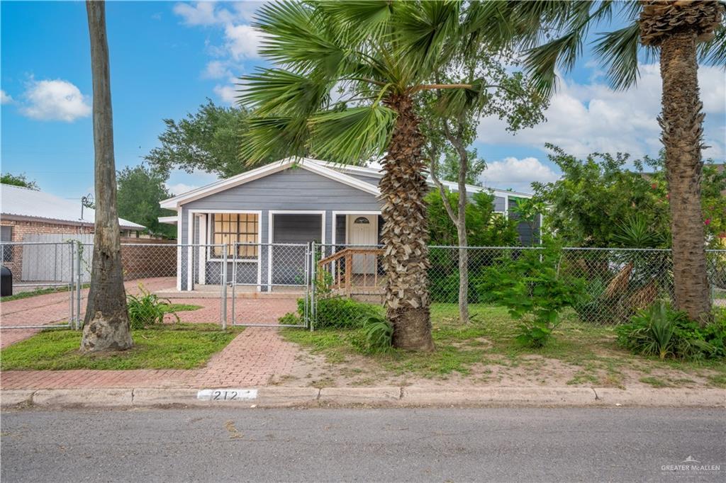 212 North Street Mission, TX 78572 - Photo 2 of 26 a front view of a house with garden