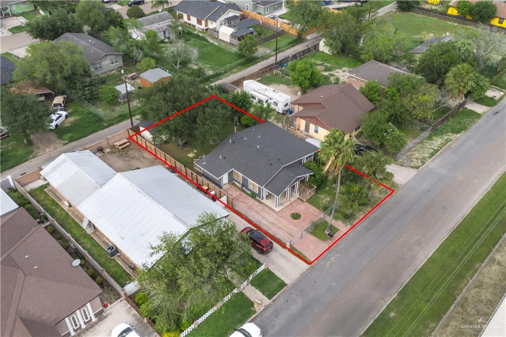 212 North Street Mission, TX 78572 - Photo 21 of 26 an aerial view of a residential apartment building with a yard