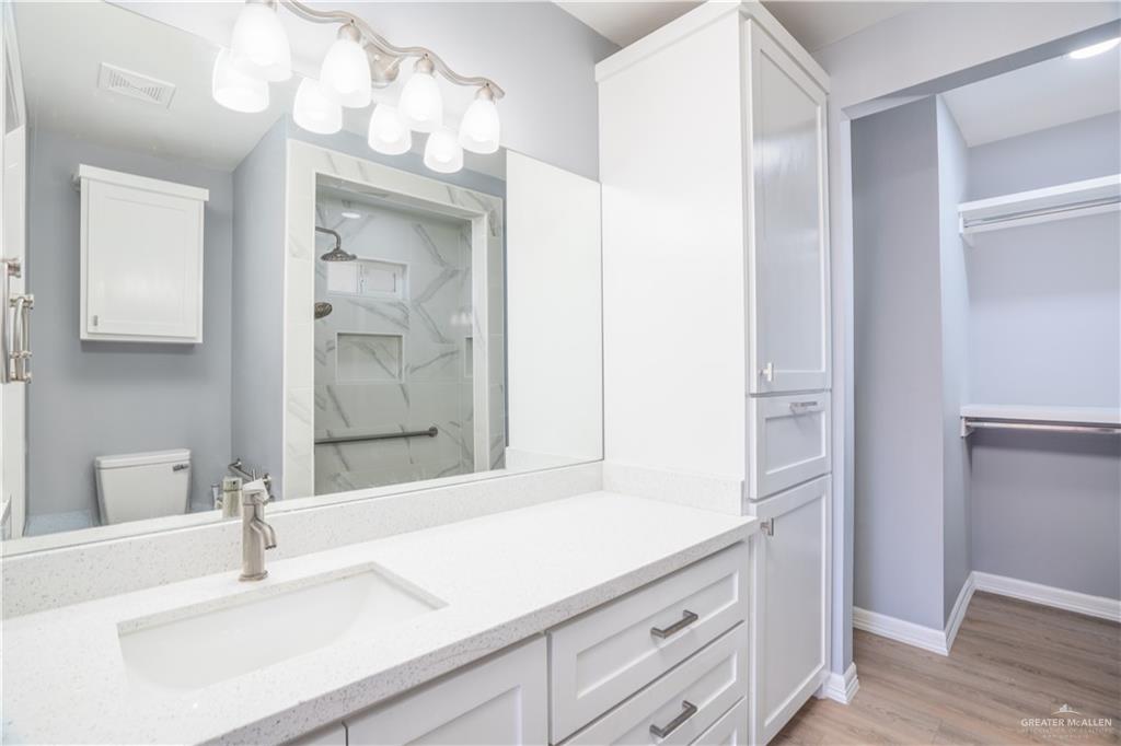 212 North Street Mission, TX 78572 - Photo 9 of 26 a bathroom with a sink and a mirror