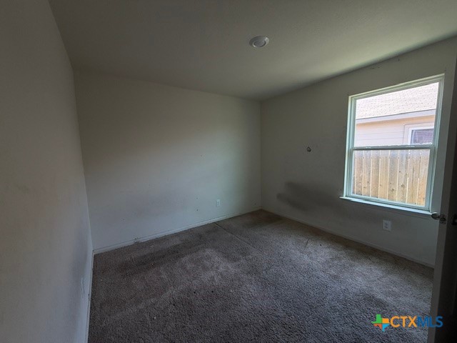 124 Niven Path Jarrell, TX 76537 - Photo 11 of 13 an empty room with a window
