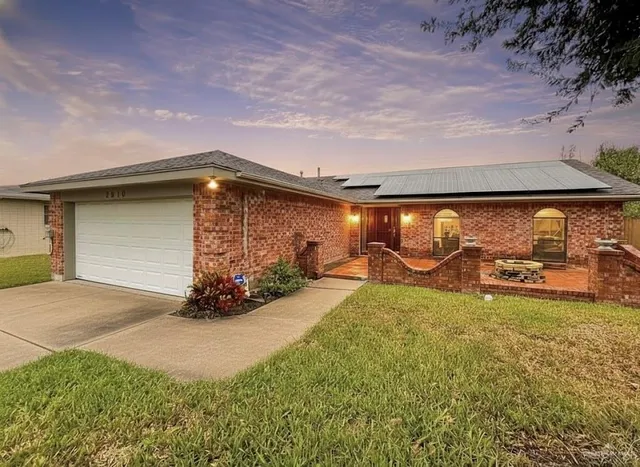 a view of a backyard of the house