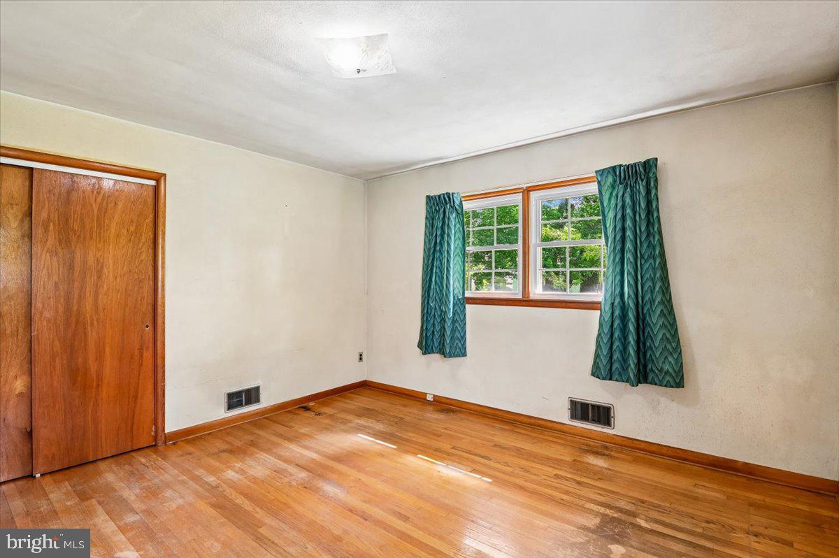 1509 Duvall Road Annapolis, MD 21409 - Photo 29 of 39 a view of an empty room with wooden floor and a window
