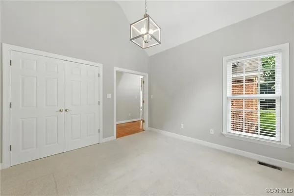 a view of an empty room with a window