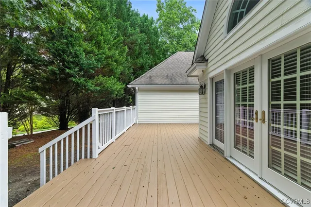 a view of a house with wooden deck