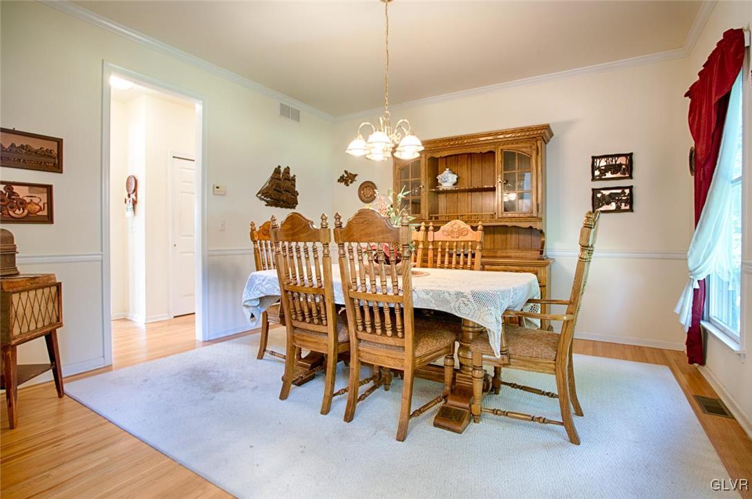 90 Morvale Road Easton, PA 18042 - Photo 12 of 38 a view of a dining room with furniture and wooden floor