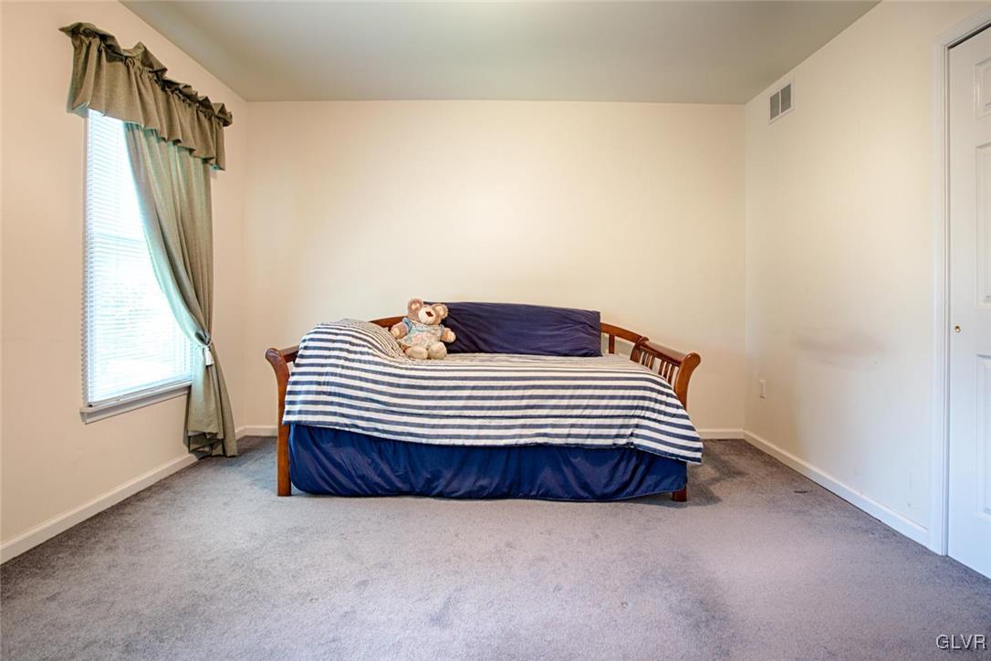 90 Morvale Road Easton, PA 18042 - Photo 29 of 38 a bedroom with a chair and a window