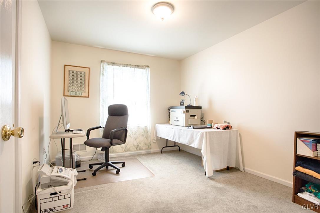 90 Morvale Road Easton, PA 18042 - Photo 31 of 38 a view of a workspace with furniture and a window