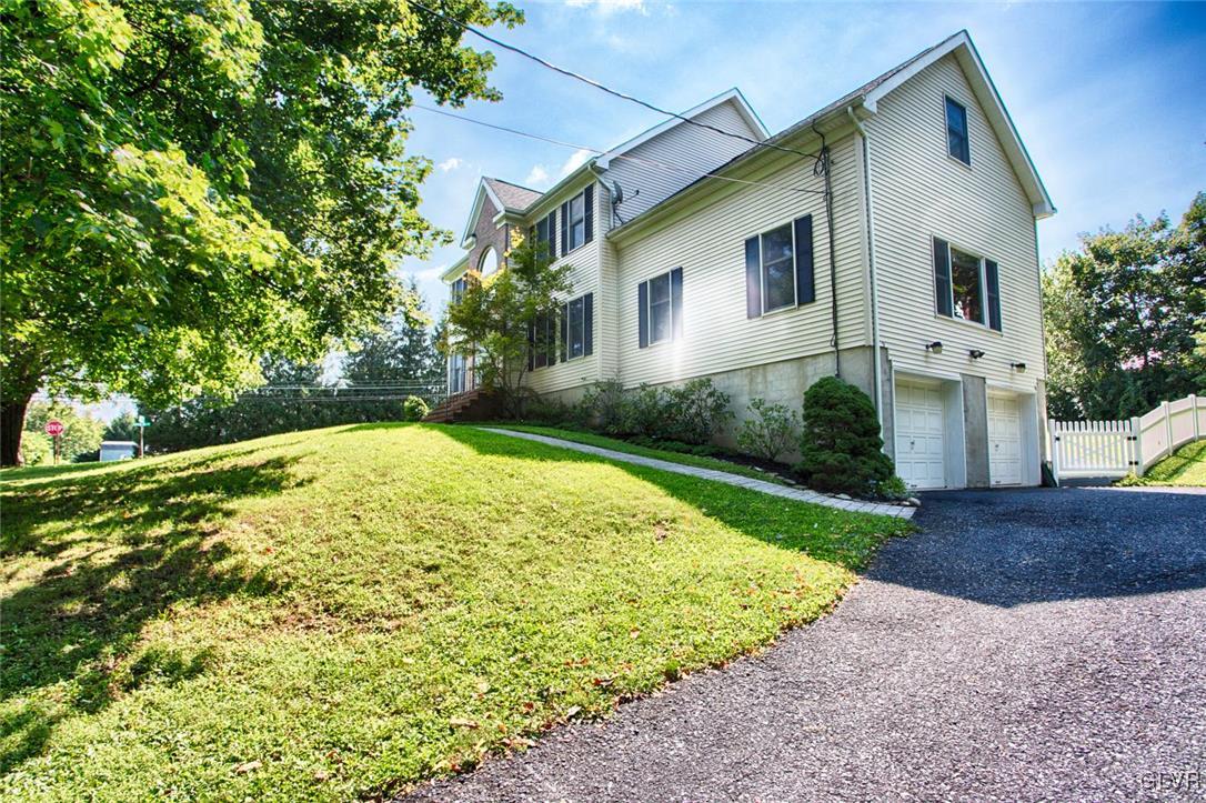 90 Morvale Road Easton, PA 18042 - Photo 37 of 38 a view of a white house with a yard and plants