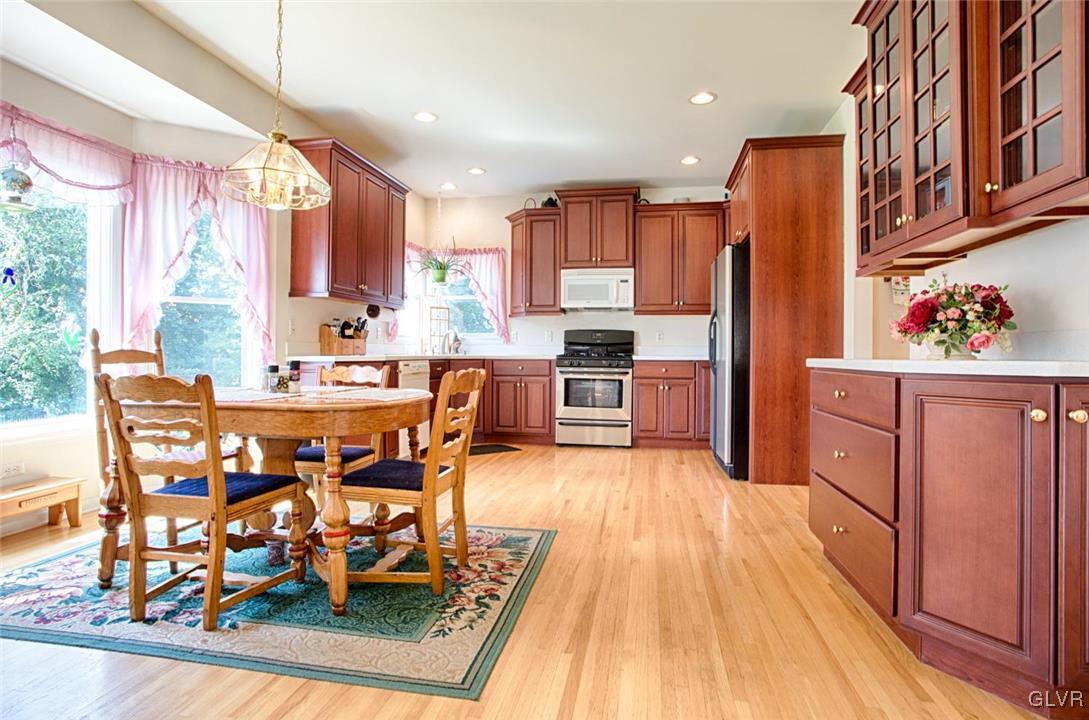 90 Morvale Road Easton, PA 18042 - Photo 8 of 38 a dining table chairs and a refrigerator