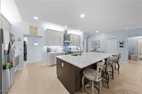 a large kitchen with a table and chairs