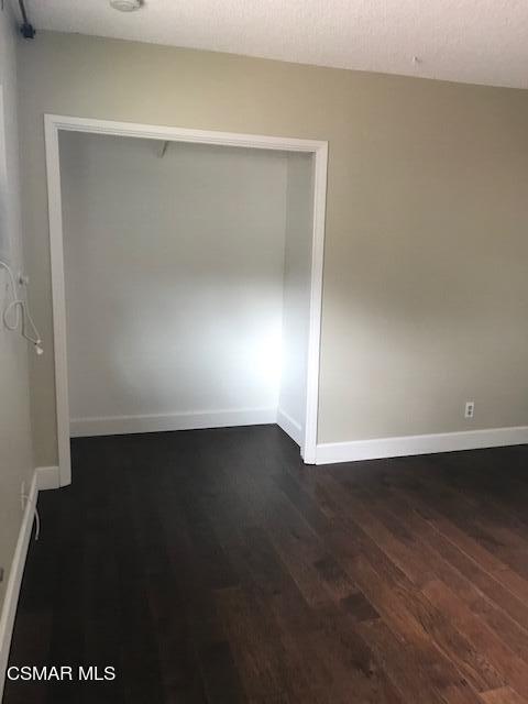 930 Alta Vista Road Simi Valley, CA 93063 - Photo 32 of 39 an empty room with wooden floor and closet
