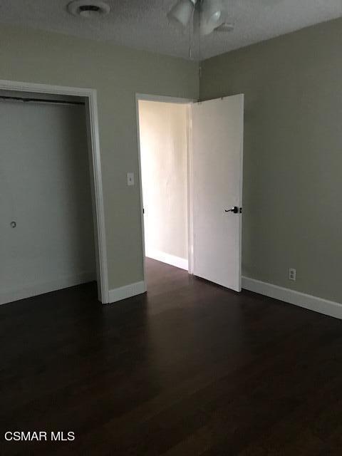 930 Alta Vista Road Simi Valley, CA 93063 - Photo 36 of 39 an empty room with wooden floor and windows