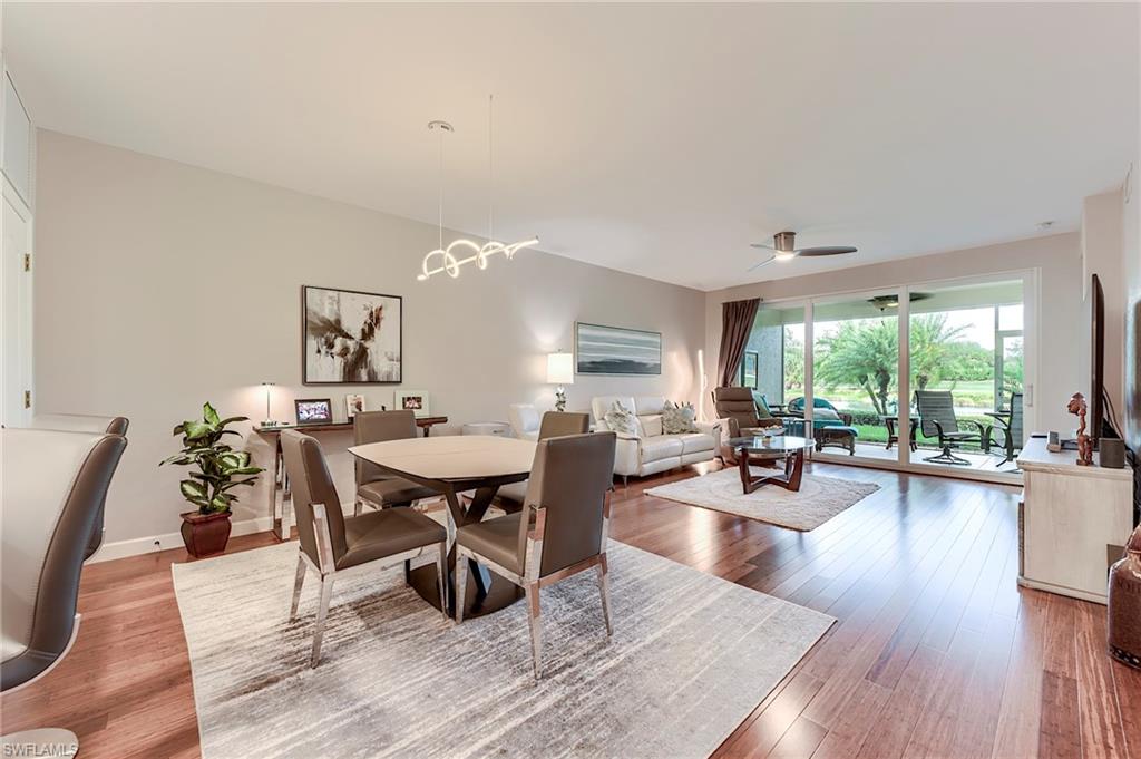 23815 Clear Spring Court, Unit 2105 Estero, FL 34135 - Photo 11 of 37 a living room with furniture and a wooden floor