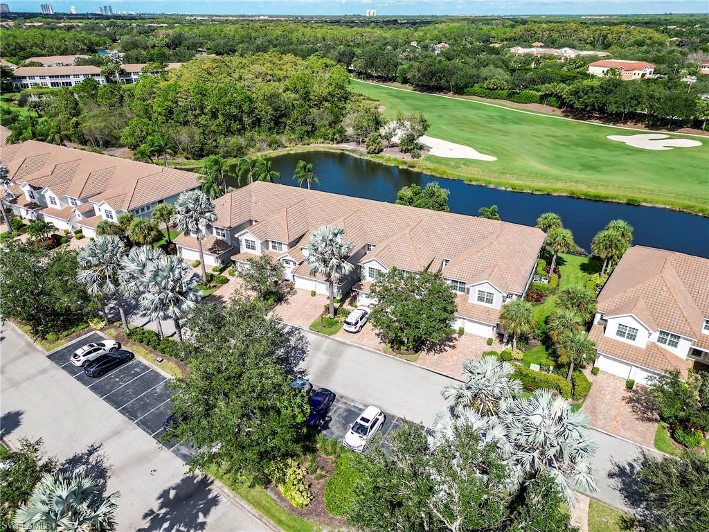 23815 Clear Spring Court, Unit 2105 Estero, FL 34135 - Photo 24 of 37 an aerial view of a house with a garden and lake view