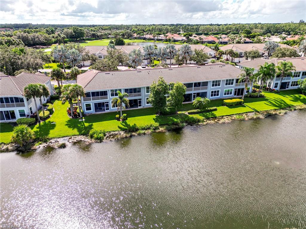 23815 Clear Spring Court, Unit 2105 Estero, FL 34135 - Photo 25 of 37 an aerial view of a house with a swimming pool yard and outdoor seating