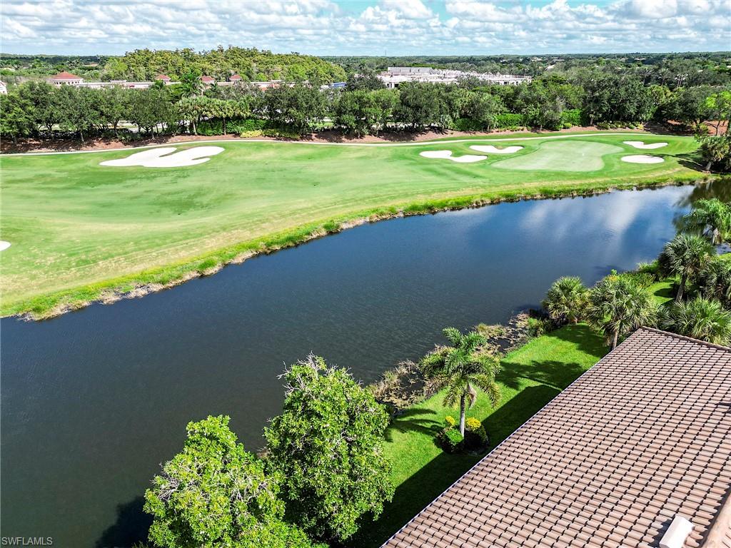 23815 Clear Spring Court, Unit 2105 Estero, FL 34135 - Photo 28 of 37 a view of a lake with a big yard